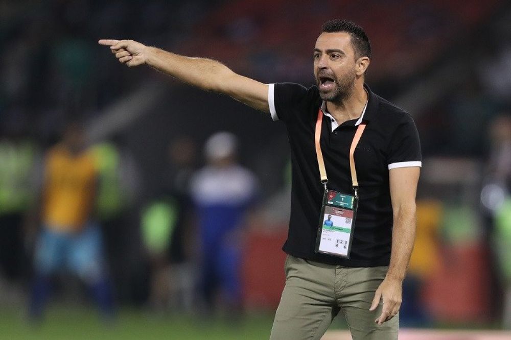 MELAWAN CORONA: Manajer Al Sadd Xavi Hernandez memberikan arahan saat timnya meladeni Hienghene Sports dalam putaran pertama Piala Dunia Antarklub di Stadion Jassim bin Hamad, Doha, Qatar, Rabu (11/12/2019) waktu setempat. (ANTARA/AFP/Karim Jaafar)

