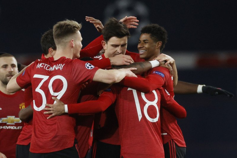 Striker Manchester United Marcus Rashford merayakan gol bersama rekan-rekan satu tim saat mengalahkan RB Leipzig dalam laga grup Liga Champions di Old Trafford, Manchester, Inggris, 28 Oktober 2020. (REUTERS/PHIL NOBLE)

