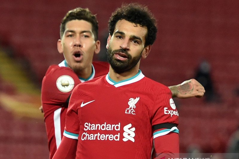 Selebrasi Mohamed Salah setelah cetak gol dalam pertandingan liga Inggris antara Liverpool vs Tottenham Hotspur di Anfield, Liverpool, Inggris pada 16 Desember 2020.(Pool via REUTERS/PETER POWELL)