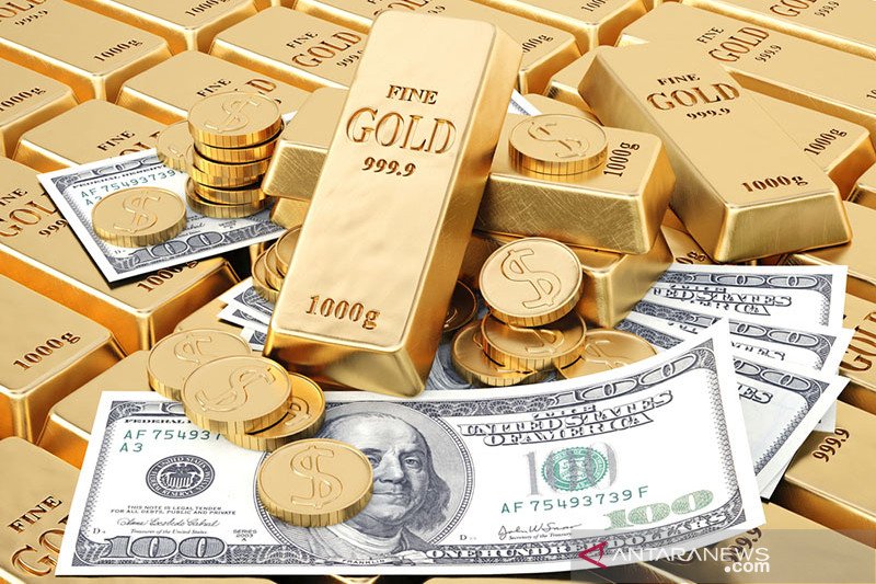 Ilustrasi - Emas batangan dan uang dolar AS. ANTARA/Shutterstock/pri.

